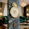 WC776-Luxury Golden Pendulum Wall Clock with Sculptural Elephant Motif and Iridescent Design Dial (1)